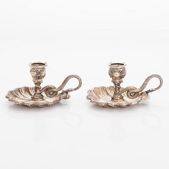 A pair of mid-19th-century silver night candle holders from Sweden.