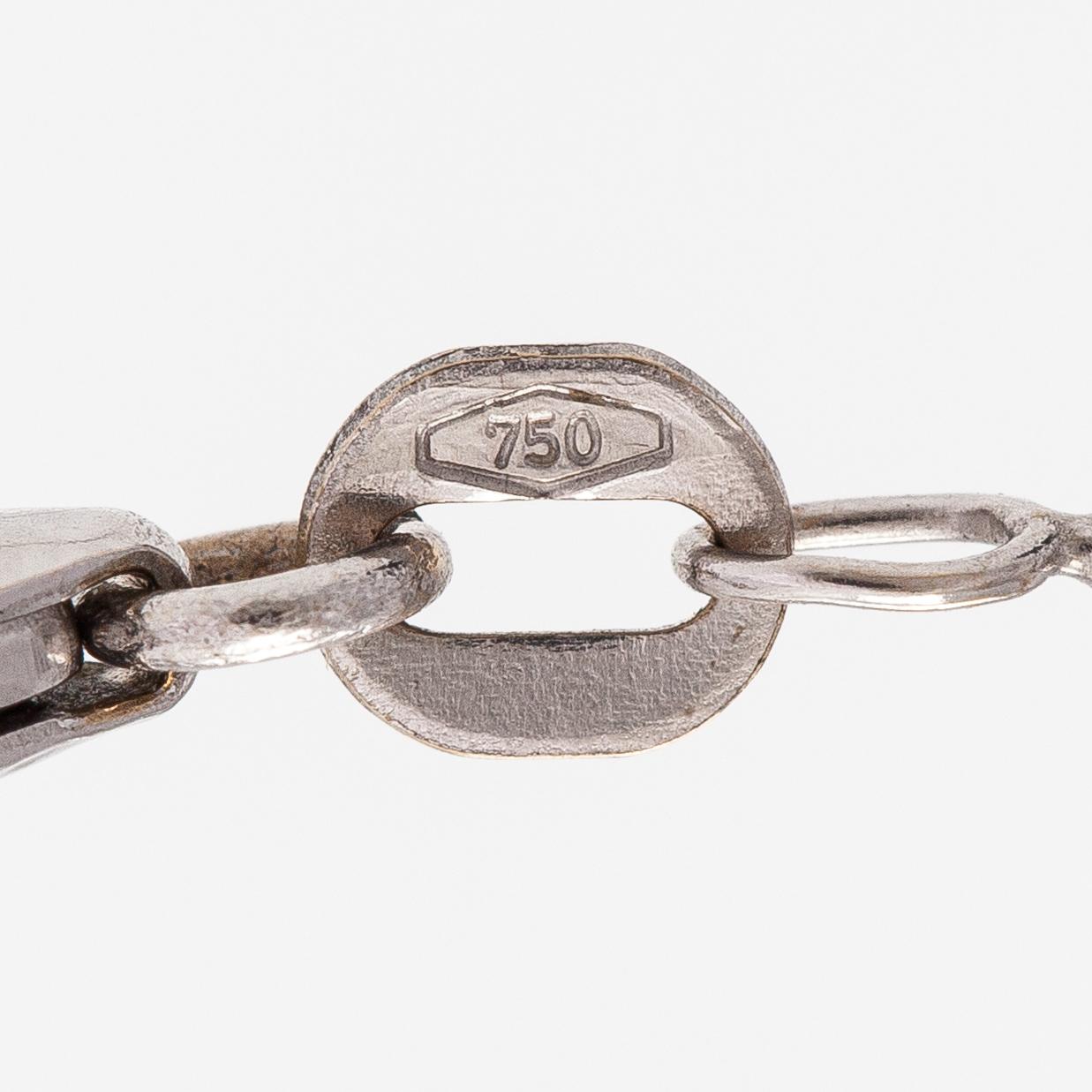 An 18K white gold necklace with a tanzanite and diamonds ca. 0.06 ct in total.