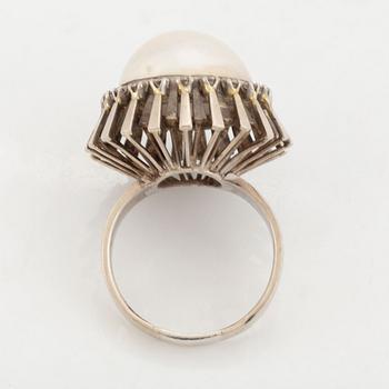 A pearl and diamond ring.
