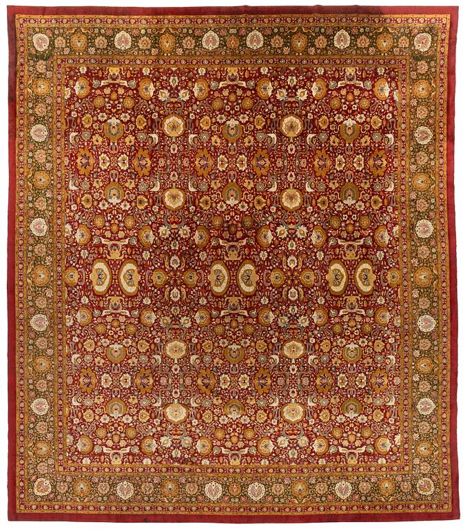 An antique Lahore carpet, northern India (todays Pakistan), approx. 463 x 404 cm.