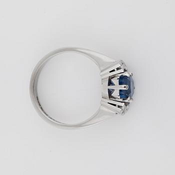 A sapphire and brilliant-cut diamond ring.