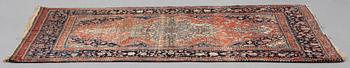 A RUG, a semi-antique Kashan Motachem, ca 217,5 x 134 cm.