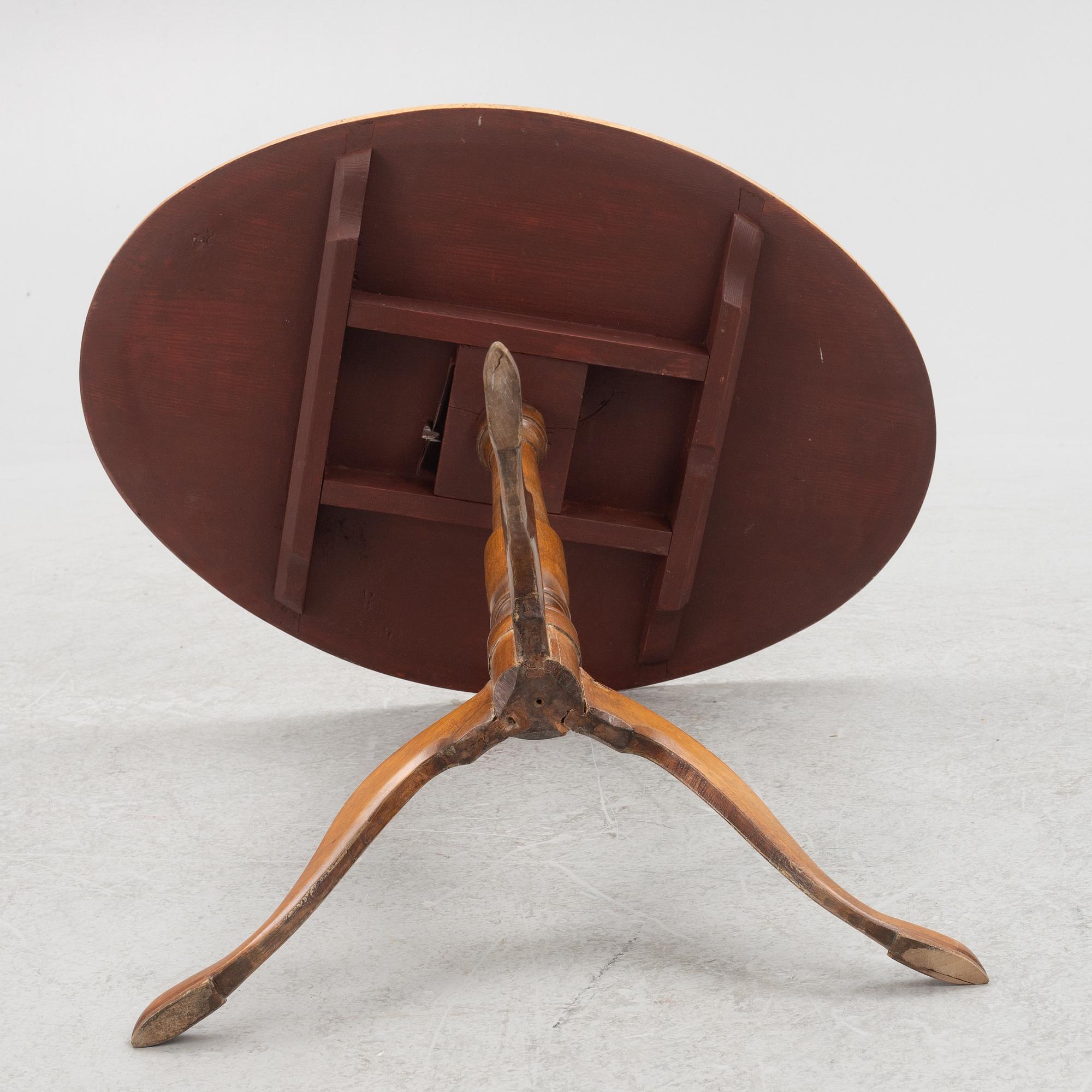 A 19th Century birch tilt top table.