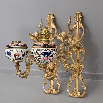A pair of wall paraffin lamps, turn of the century 1900. Made by Ljungdells Malmö Sweden.