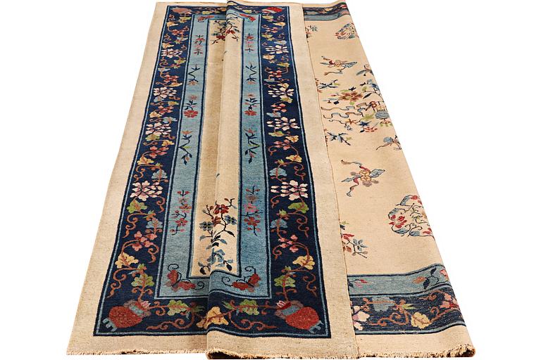 A semi-antique carpet, China, ca 360 x 272 cm.