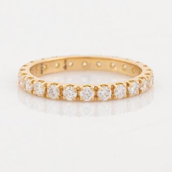 Brilliant cut diamond eternity ring.