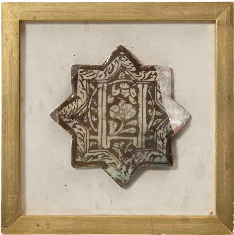 A Kashan lustre-decorated star-tile, central persia, 14th century,