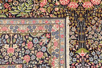 A Kirman Laver carpet, 'Millefleur', approx. 388 x 300 cm.