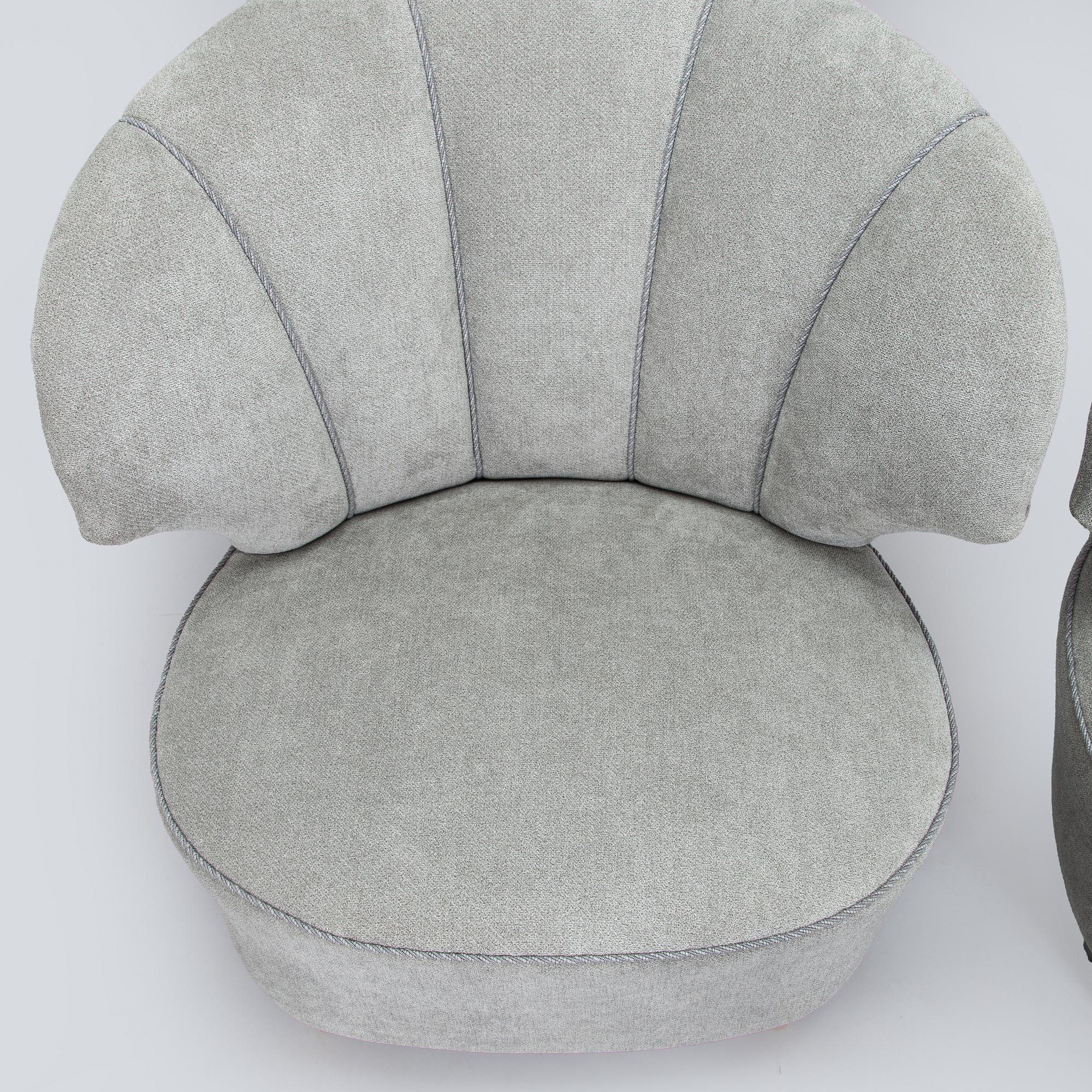 A pair of mid 20th century armchairs.