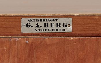 A G.A. Berg cabinet with printed map depicting the city of Stockholm, Sweden 1940's.