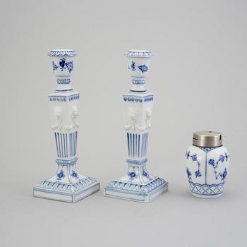 A pair of porcelain candlesticks and a lighter from Royal Copenhagen, Denmark.
