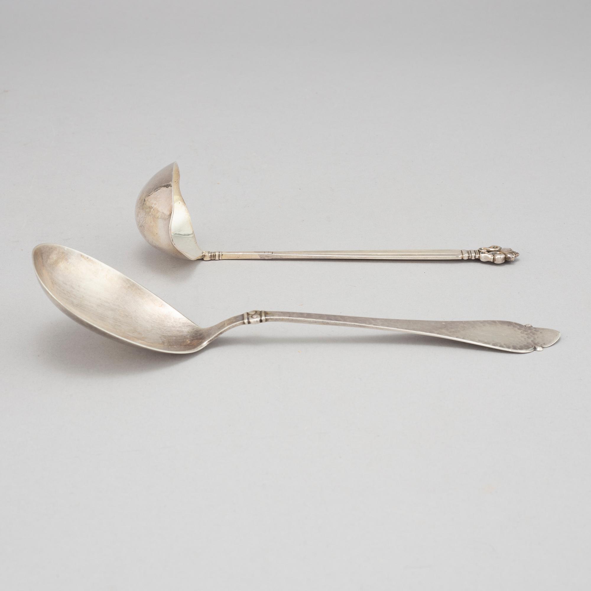 Johan Rohde, an 'Acorn' sterling sauce ladle, Georg Jensen post 1945 + a Danish silver serving spoon, Copenhagen 1931.