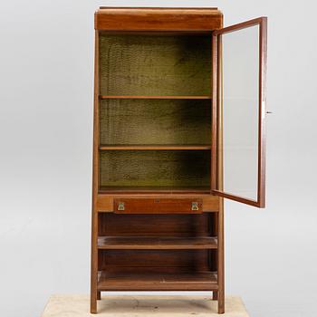 A display cabinet, early 20th Century.