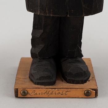 Four Carl Johan Trygg wooden sculptures, two signed and dated 1918.