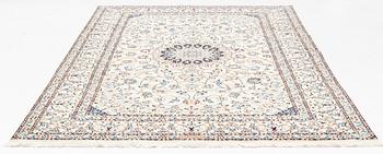 A carpet, Nain, part silk, fine 9 laa, signed, ca 327 x 210 cm.