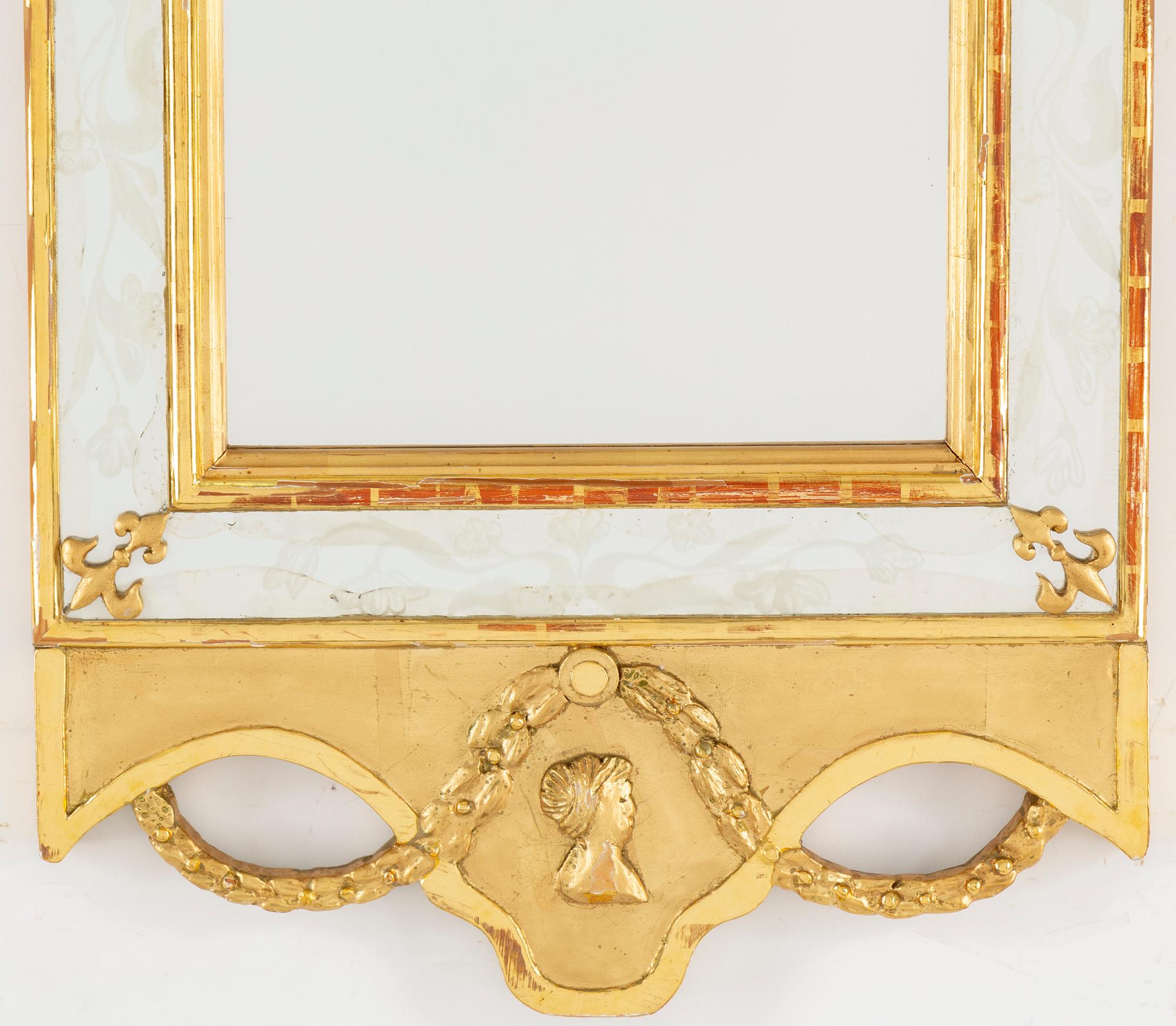 An empire style mirror, 20th century.