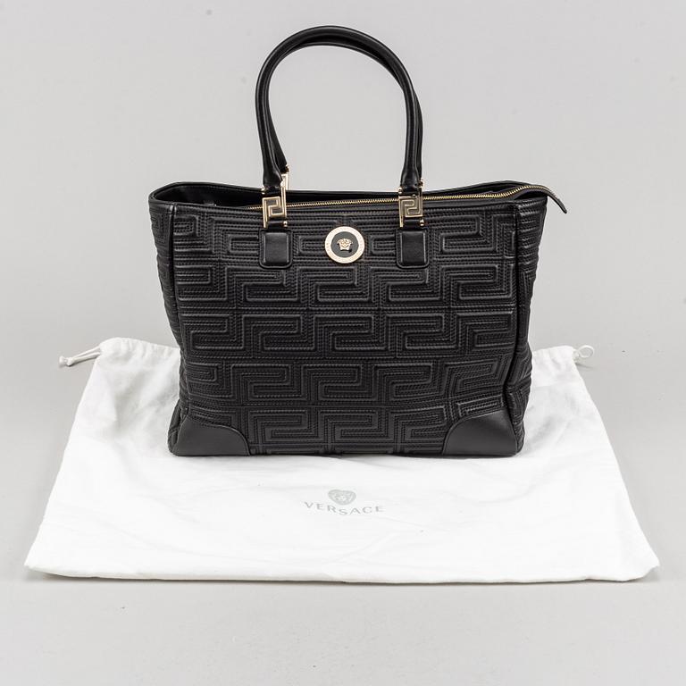 Versace, a black quilted leather handbag.