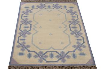 A flat weave carpet, signed MLB, ca 202 x 136 cm.