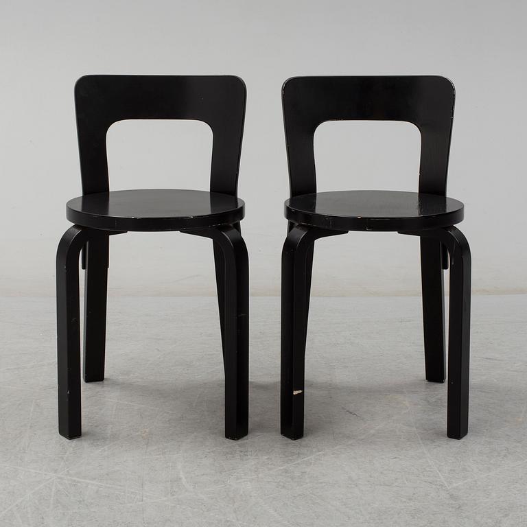 ALVAR AALTO, a pair of painted model 65 chairs from Artek, Finland.
