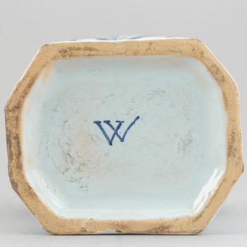 A pair of 19th century blue/white faience lidded jars, probably Dutch.