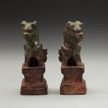 A pair of green and yellow glazed joss stick holders, Ming dynasty (1368-1644).