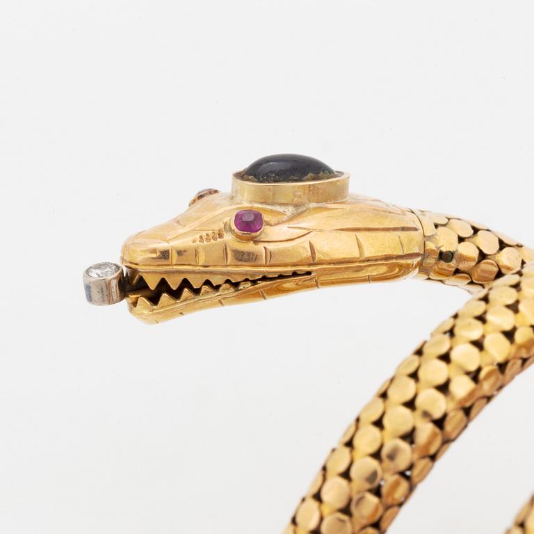 An 18K gold snake bracelet.