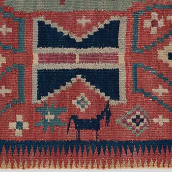 A CARRIAGE CUSHION, "Träd och timglas", double interlocked tapestry, ca 101,5 x 50,5 cm, Scania, Sweden,