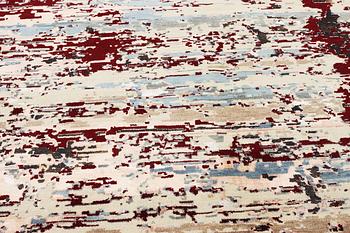 An oriental carpet with modern design, ca. 377 x 277 cm.