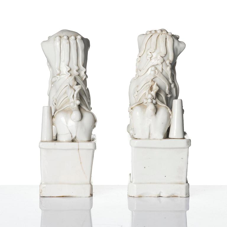 Two blanc de chine figures of buddhist lions/joss stick holders, Qing dynasty, Kangxi (1662-1722).