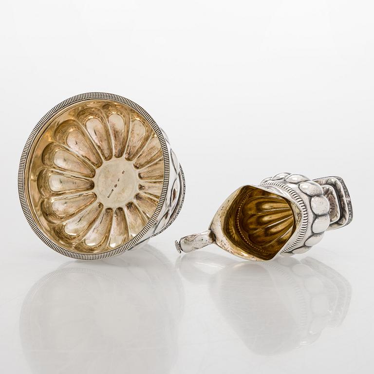 A silver cream jug by A.G. Illberg, Hamina, and a silver bonbonnière by Hj. Fagerroos, Helsingfors, 19th century.