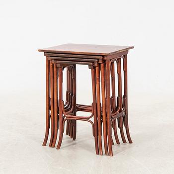 An early 19th century nest of four tables in stained beech from Thonet.