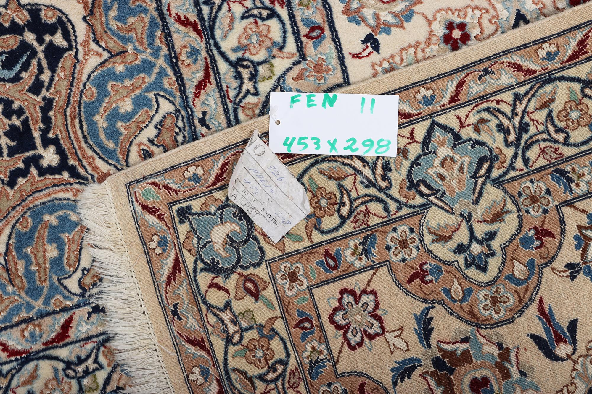 A Nain carpet, part silk, 6 laa, c. 453 x 298 cm.