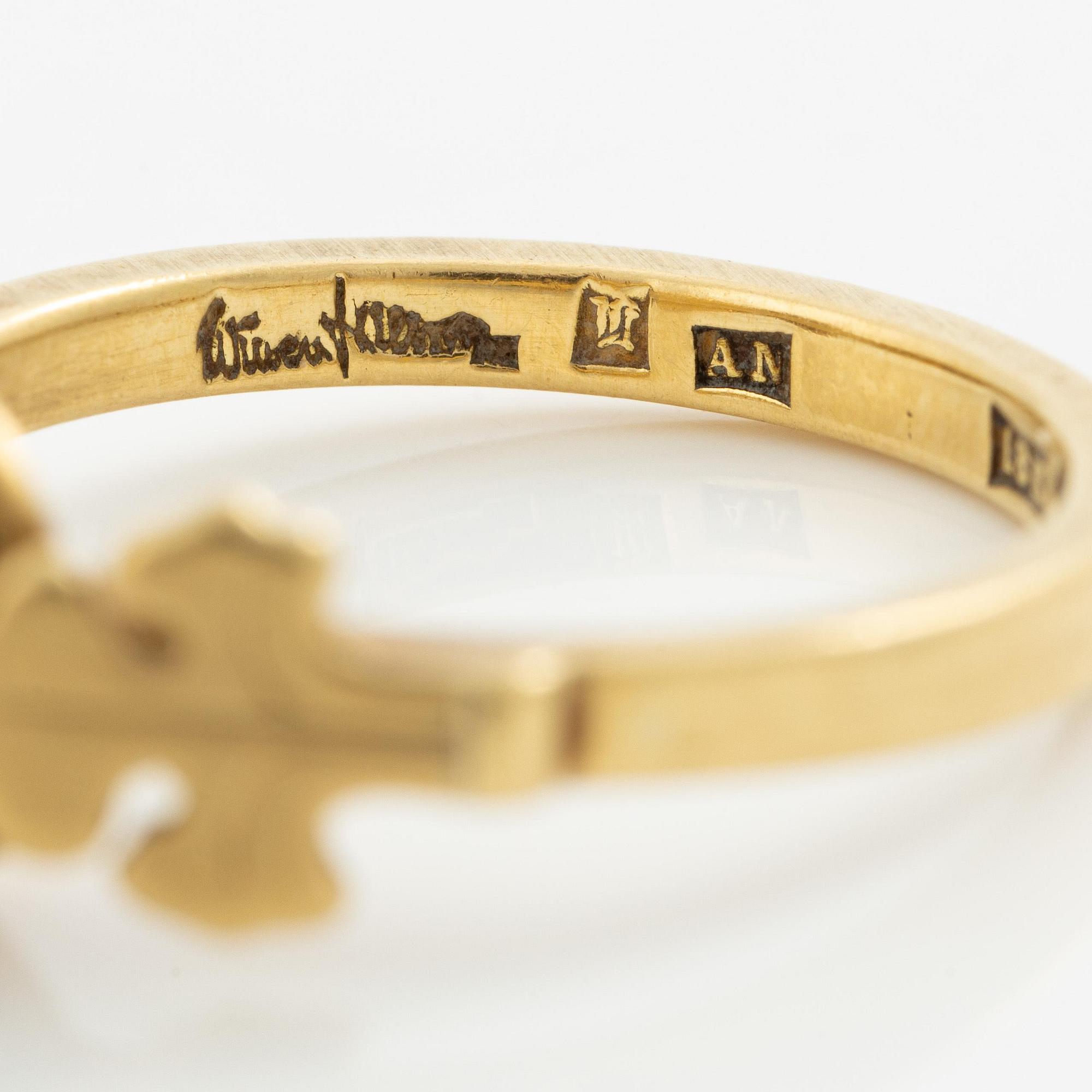 Wiwen Nilsson, a ring 18K gold with a pearl and two motifs of the french lily, Lund 1951.