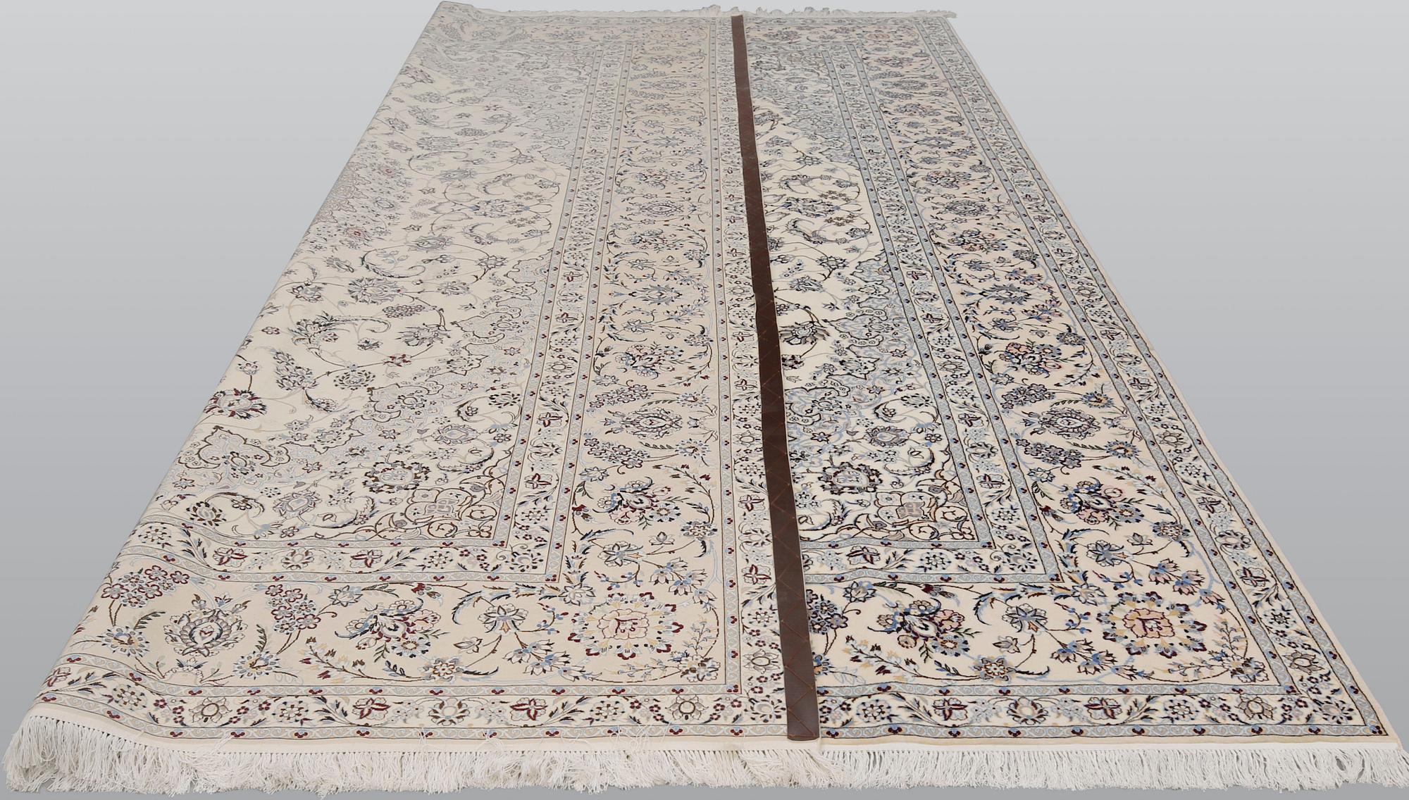 A Nain part silk carpet, 408 x 308 cm.