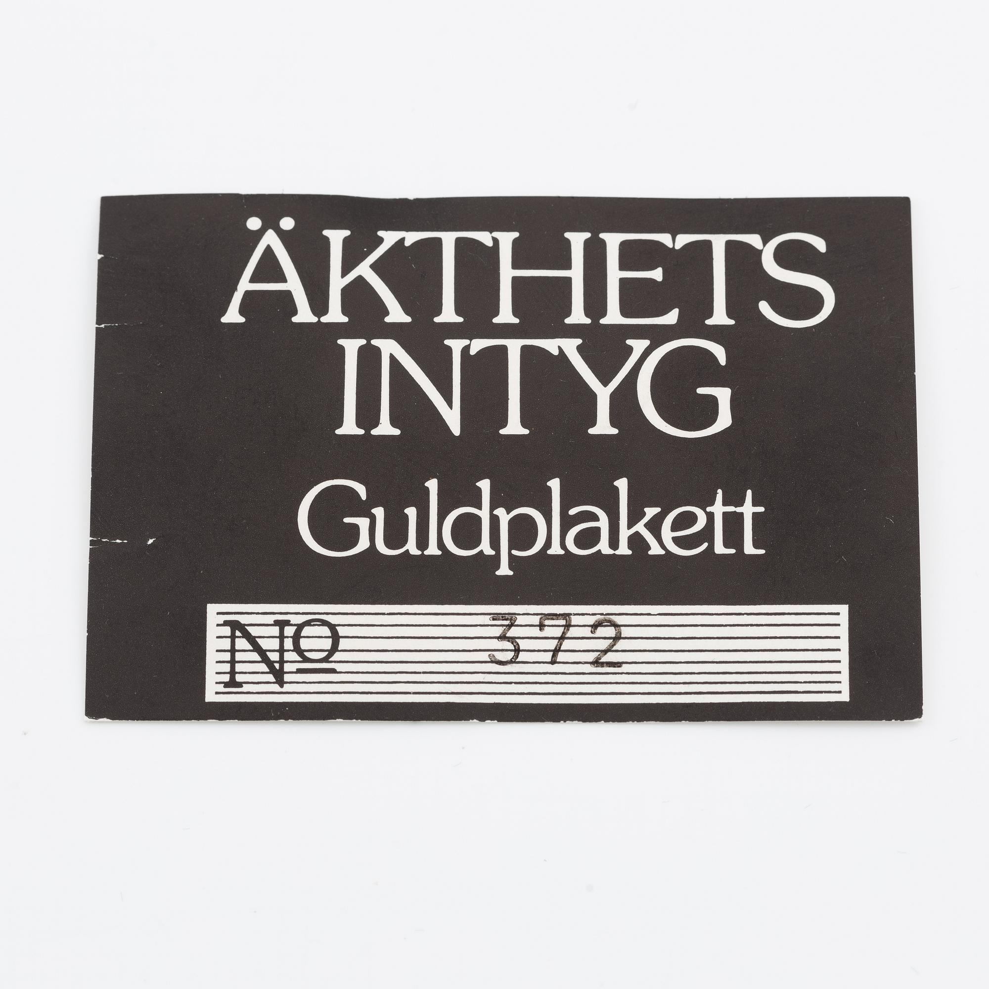 Plaque, 18K gold, numbered 372/1000, 1975, weight approx. 27 g.