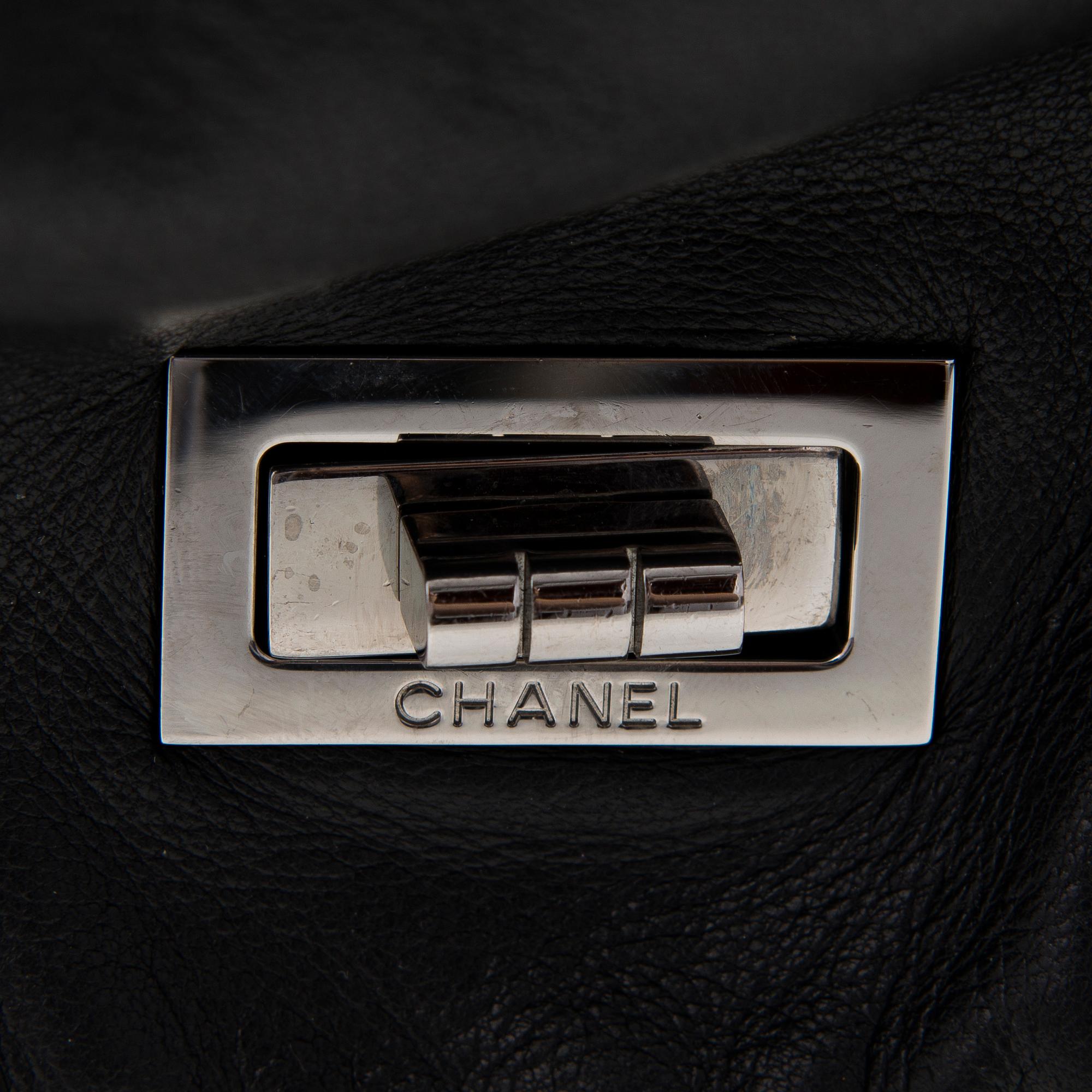 A Black Leather Double Mademoiselle Lock Flap Bag.