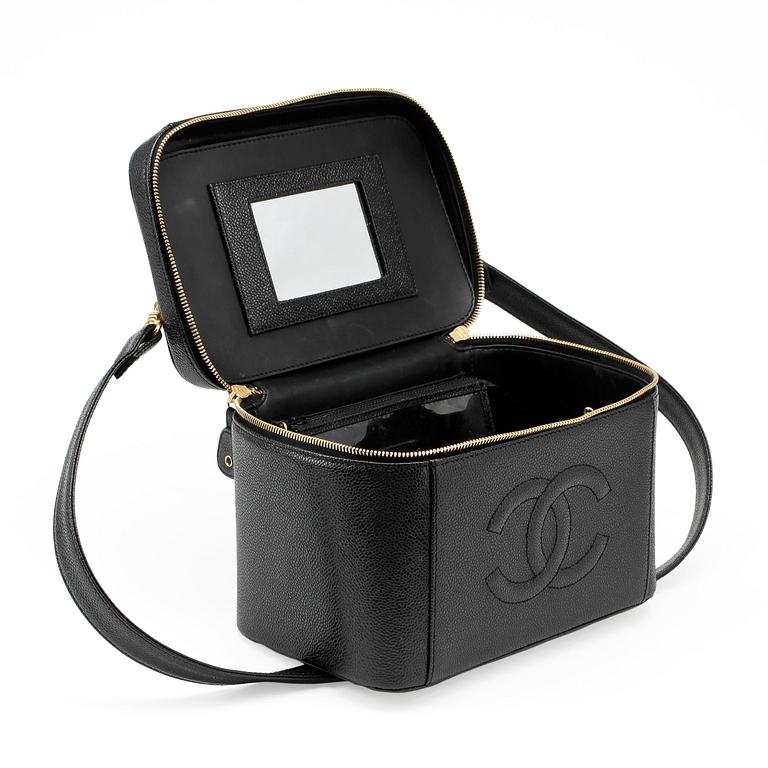 CHANEL, a black caviar leather beauty case.