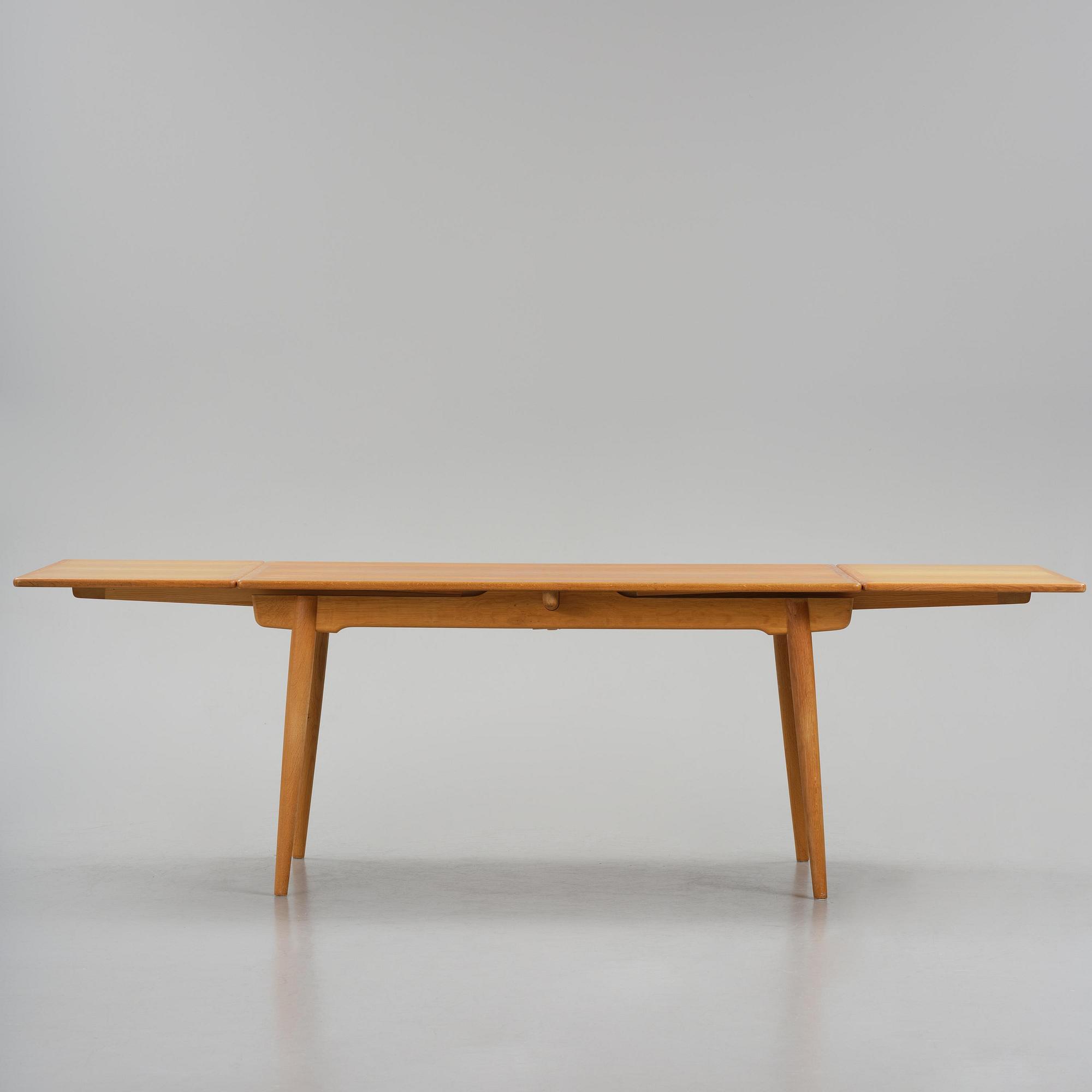 Hans J. Wegner, an "AT-312" dining table, Andreas Tuck, Denmark, 1950s-60s.