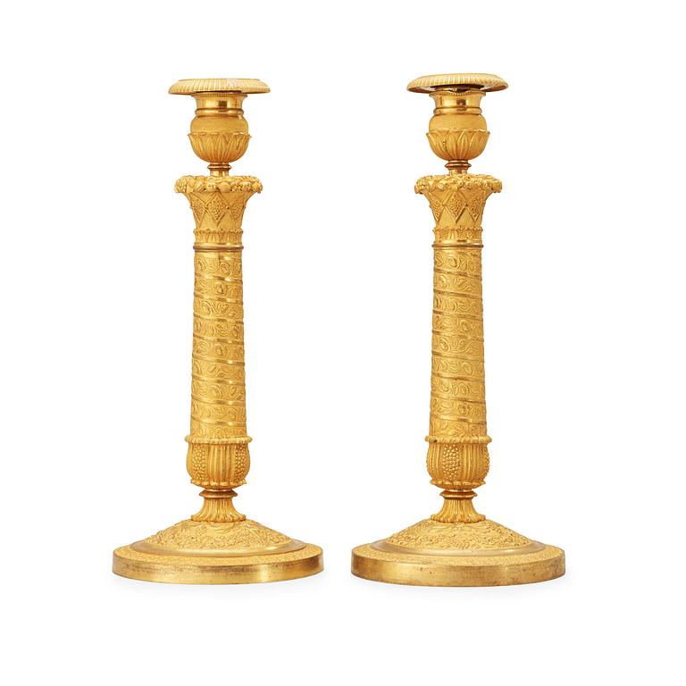 A pair of French Empire early 19th century candlesticks.