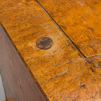 A bureau veneered in Karelian birch, mid-19th century.