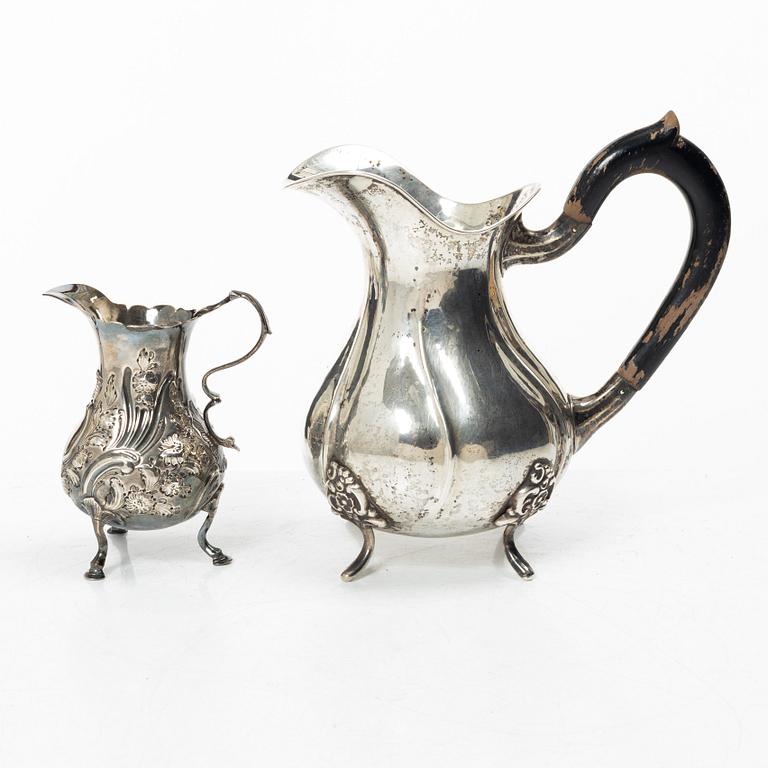 Two silver jugs, one English.