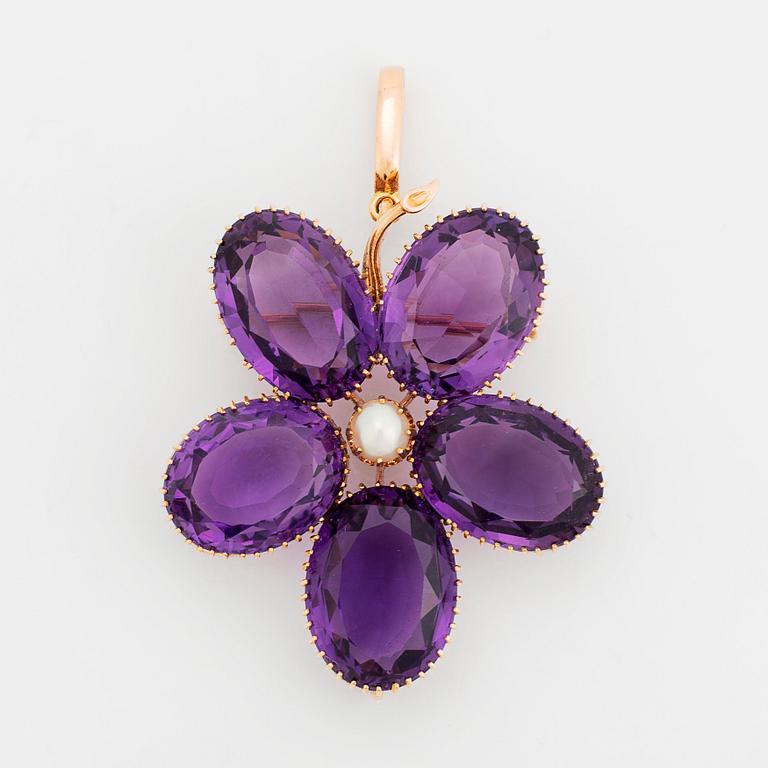 An 18K gold brooch/pendant set with faceted amethysts and a pearl.