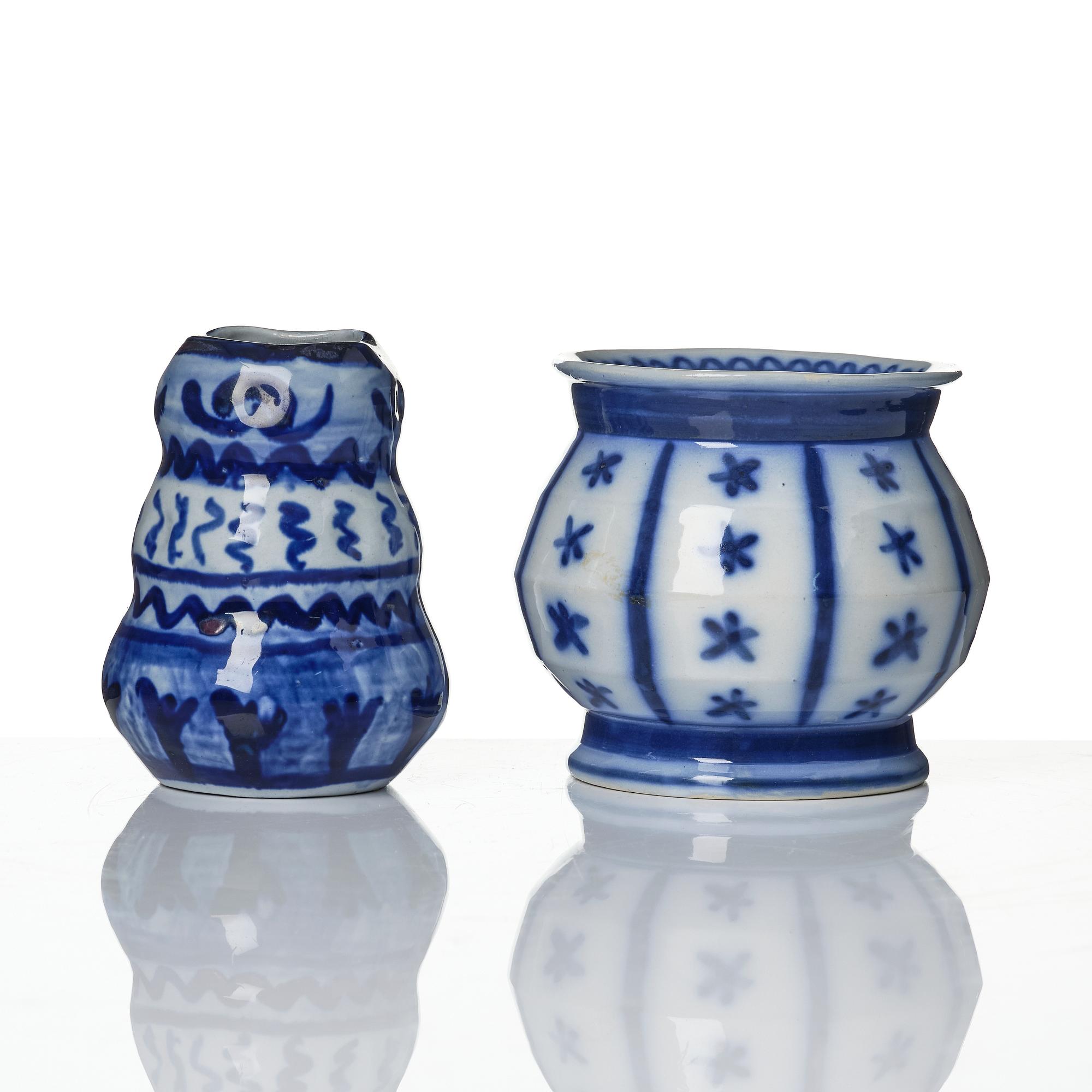 Wilhelm Kåge, a jar with cover, and four vases, creamware and porcelain, Gustavsberg, Sweden, 1917-1920.