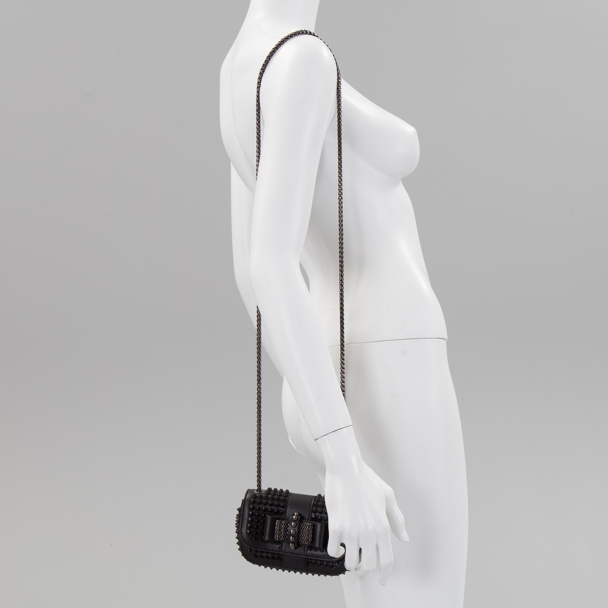 An eveningbag with studs by Christian Louboutin.