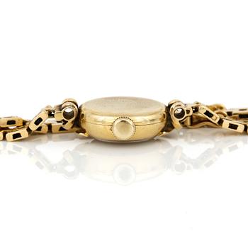 ARMBANDSUR, dam, 18K guld, 'Cyma, CymaFlex' Le Locle, Schweiz 1900-talets mitt. Total vikt ca 18,97 g.