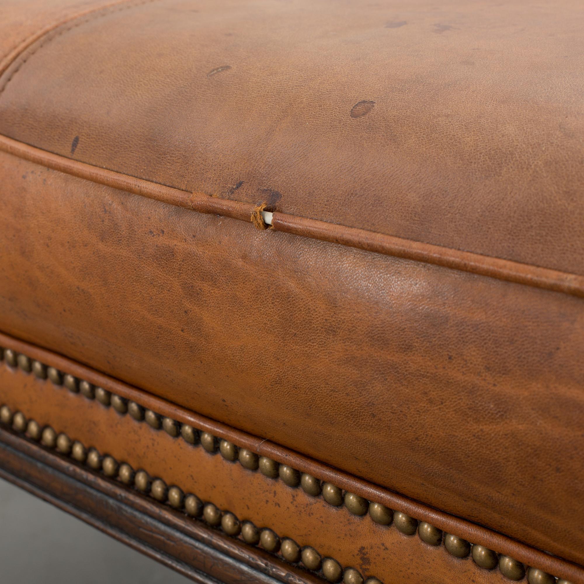 A CHESTERFIELD STYLE OTTOMAN, around year 2000.