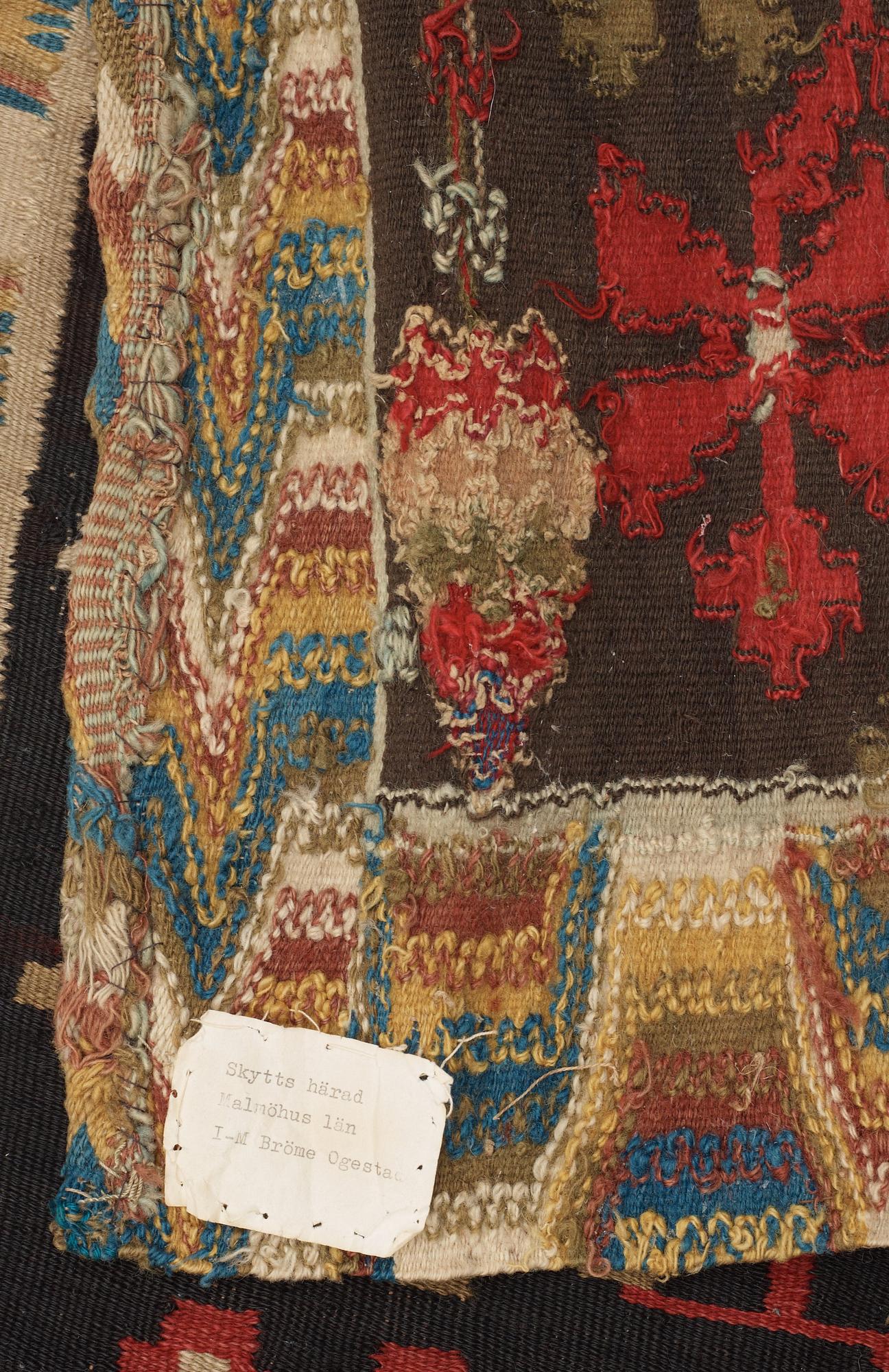 CARRIAGE CUSHION. Rölakan (flat weave). 51,5 x 114 cm. Skåne, Skytts härad (district), dated 1819.