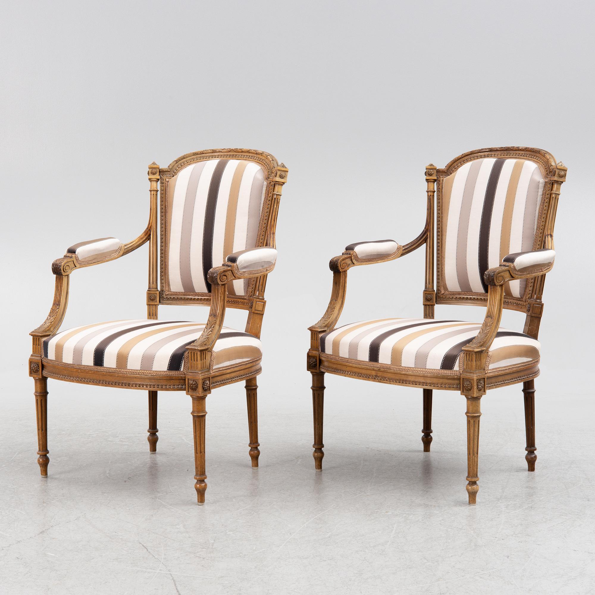 A pair of Louis XVI-style armchairs, late 19th century.