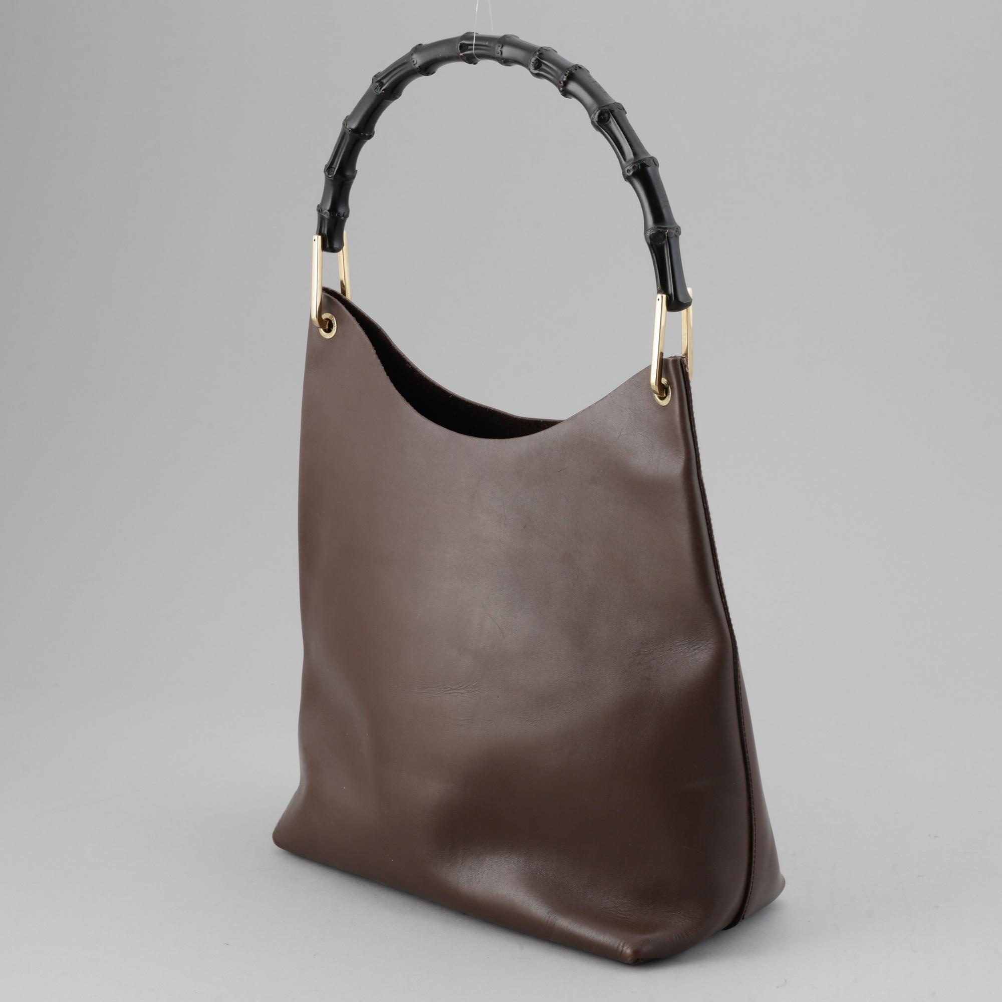 Gucci, a leather bag.