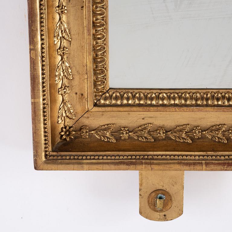 A pair of Swedish Empire mirror wall sconces, first half of the 19th century.